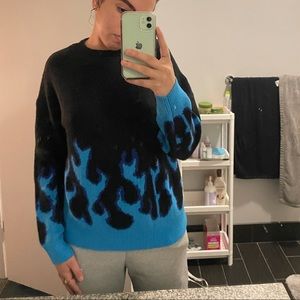 Drop shoulder sweater with blue flames on bottom and half-way up sleeves!